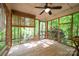 Relaxing screened-in porch with natural wood flooring and wooded views at 7230 Ridge Lane Rd, Charlotte, NC 28262