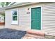 Charming home exterior showcasing a green front door with brick steps and tasteful landscaping at 817 32Nd Street Ne Dr, Conover, NC 28613