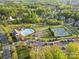 Aerial shot of Olmsted community with pool, tennis courts, playground, and winding roads at 8903 Ansley Park Pl, Huntersville, NC 28078