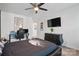Comfortable bedroom with a black bed and a fan at 8903 Ansley Park Pl, Huntersville, NC 28078