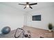 Bright room with fitness equipment and hardwood floors at 8903 Ansley Park Pl, Huntersville, NC 28078