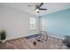 Open room with fitness equipment and bright blue walls at 8903 Ansley Park Pl, Huntersville, NC 28078