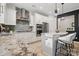 Updated kitchen featuring granite counters, stainless steel appliances, and a breakfast bar at 8903 Ansley Park Pl, Huntersville, NC 28078