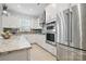 Updated kitchen featuring granite counters and stainless steel appliances at 8903 Ansley Park Pl, Huntersville, NC 28078