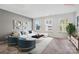 Bright living room with comfortable white sofa and a large rug at 8903 Ansley Park Pl, Huntersville, NC 28078
