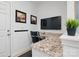 Office featuring granite counters and a TV at 8903 Ansley Park Pl, Huntersville, NC 28078