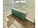Modern bathroom featuring a double vanity, white countertops, and gold fixtures at 9003 Brad Ct, Matthews, NC 28104