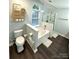 Bathroom featuring a soaking tub, enclosed shower, and a neutral color palette at 9003 Brad Ct, Matthews, NC 28104