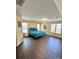 Spacious bedroom with multiple windows, dark wood floors, and a comfortable bed at 9003 Brad Ct, Matthews, NC 28104