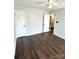 This is an empty bedroom with hardwood floors and an open closet at 9003 Brad Ct, Matthews, NC 28104