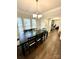 Spacious dining room with a long table and views into other rooms at 9003 Brad Ct, Matthews, NC 28104