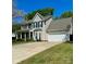 Beautiful two-story home featuring a spacious driveway and attached garage at 9003 Brad Ct, Matthews, NC 28104
