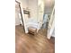 Hallway with new hardwood flooring and a bench at 9003 Brad Ct, Matthews, NC 28104