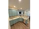 Beautiful kitchen with granite countertops, stainless steel appliances, and blue cabinets at 9003 Brad Ct, Matthews, NC 28104