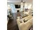 Bright living room features a fireplace, ceiling fan, lots of natural light, and comfortable seating at 9003 Brad Ct, Matthews, NC 28104