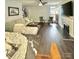Open-concept living room with fireplace, hardwood floors, and comfortable seating at 9003 Brad Ct, Matthews, NC 28104