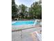 Backyard pool with slide, surrounded by a concrete patio, a shed, and a hammock for ultimate relaxation at 9003 Brad Ct, Matthews, NC 28104