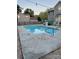 This backyard features a beautiful swimming pool, slide, and fenced yard at 9003 Brad Ct, Matthews, NC 28104