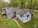 Exterior aerial view showing deck, outbuilding, and lush green lawn at 9216 Caycee Dr # 32, Davidson, NC 28036