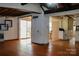 Spacious living room featuring hardwood floors and a sliding door to outside deck at 9216 Caycee Dr # 32, Davidson, NC 28036
