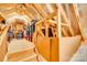 Organized attic featuring wood beams and ample storage space at 953 Kirby Dr, Fort Mill, SC 29715