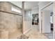 A tiled shower is shown in the bathroom next to the walk-in closet at 953 Kirby Dr, Fort Mill, SC 29715