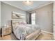 Nautical-themed bedroom with a full-sized bed, accent pieces, and natural lighting at 953 Kirby Dr, Fort Mill, SC 29715