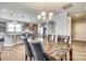 Elegant dining room with hardwood floors that opens into a spacious kitchen with an oversized kitchen island at 953 Kirby Dr, Fort Mill, SC 29715
