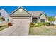 Inviting single-story home with a manicured front lawn and an attached two-car garage at 953 Kirby Dr, Fort Mill, SC 29715
