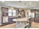Modern kitchen boasts stainless steel appliances, granite countertops, and a large island with pendant lighting at 953 Kirby Dr, Fort Mill, SC 29715