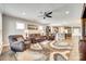 Spacious living room featuring hardwood floors, ceiling fan, and comfortable seating that is open to kitchen at 953 Kirby Dr, Fort Mill, SC 29715