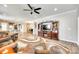 Inviting living room flows to the kitchen and dining area, with hardwood floors, and neutral paint at 953 Kirby Dr, Fort Mill, SC 29715