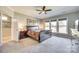 Spacious main bedroom with large windows and a ceiling fan for added comfort at 953 Kirby Dr, Fort Mill, SC 29715