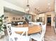 Dining area with a round table and chairs, connecting to the kitchen and living area in an open-concept design at 10035 Mast Cove Ln, Charlotte, NC 28278