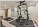 Home gym featuring exercise equipment, mirror and a sauna in the corner at 10035 Mast Cove Ln, Charlotte, NC 28278