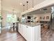 Open-concept kitchen featuring an island with granite countertops and seamlessly connected to the dining and living areas at 10035 Mast Cove Ln, Charlotte, NC 28278