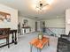 Stylish loft boasts plush carpeting, comfortable seating, a unique light fixture, and ample space at 10035 Mast Cove Ln, Charlotte, NC 28278