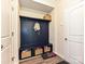 Well-organized mudroom with storage bench, cubbies, and coat hooks for entry convenience at 10035 Mast Cove Ln, Charlotte, NC 28278