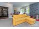 Bright recreation room with a cozy yellow sectional and a climbing wall at 10035 Mast Cove Ln, Charlotte, NC 28278