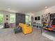 Large rec room with climbing wall, play area and walkout to the backyard at 10035 Mast Cove Ln, Charlotte, NC 28278