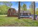 Brick home with a wooden deck and expansive backyard, perfect for outdoor living at 101 Grier St, York, SC 29745