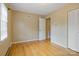 Neutral paint and gleaming hardwood floors add a light and airy touch to this bedroom at 101 Grier St, York, SC 29745