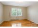 Bright bedroom featuring hardwood floors and a window providing ample natural light at 101 Grier St, York, SC 29745