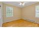 This bedroom offers hardwood floors, lots of natural light, and a ceiling fan at 101 Grier St, York, SC 29745