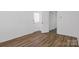 Bedroom with durable wood-look floors, neutral wall paint, and a doorway to other rooms at 101 Grier St, York, SC 29745