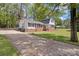 Charming brick and siding home with well-manicured lawn and mature trees at 101 Grier St, York, SC 29745