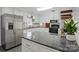 Bright kitchen featuring white cabinets, stainless steel appliances, and granite countertops at 101 Grier St, York, SC 29745