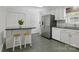 Stylish kitchen with stainless steel refrigerator, stone floors, and an eat-in island at 101 Grier St, York, SC 29745