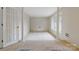 Spacious living area with carpet, columns, and plentiful natural light from large windows at 101 Grier St, York, SC 29745