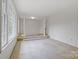 Bright living room featuring large windows and an elegant elevated area with columns at 101 Grier St, York, SC 29745